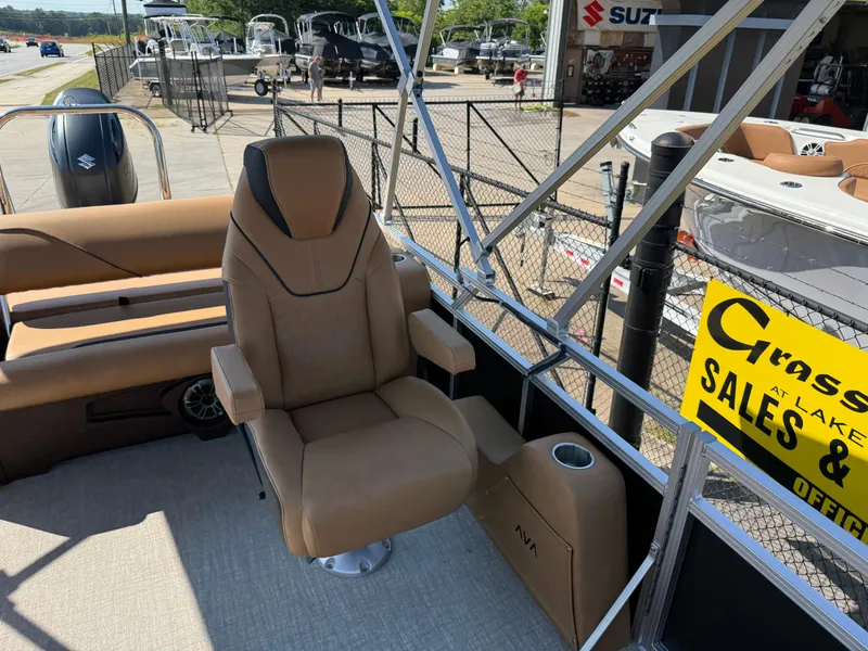 Slide: The Image of 2025 Avalon Venture 85 Versatile rear bench with luxurious seating at a boat dealership. - 26