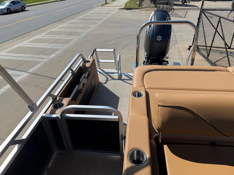 Slide: The Image of 2025 Avalon Venture 85 Versatile rear bench with tan seating and Suzuki outboard motor. - 30