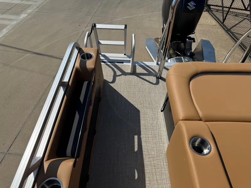 Slide: The Image of 2025 Avalon Venture 85 Versatile rear bench with tan seating and cup holders. - 33