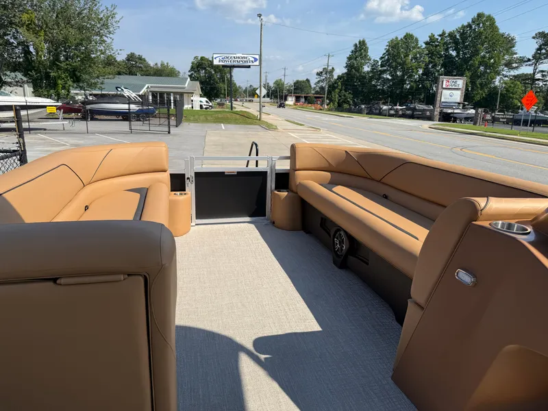 Slide: The Image of 2025 Avalon Venture 85 Versatile rear bench with tan seating, parked near a road. - 42