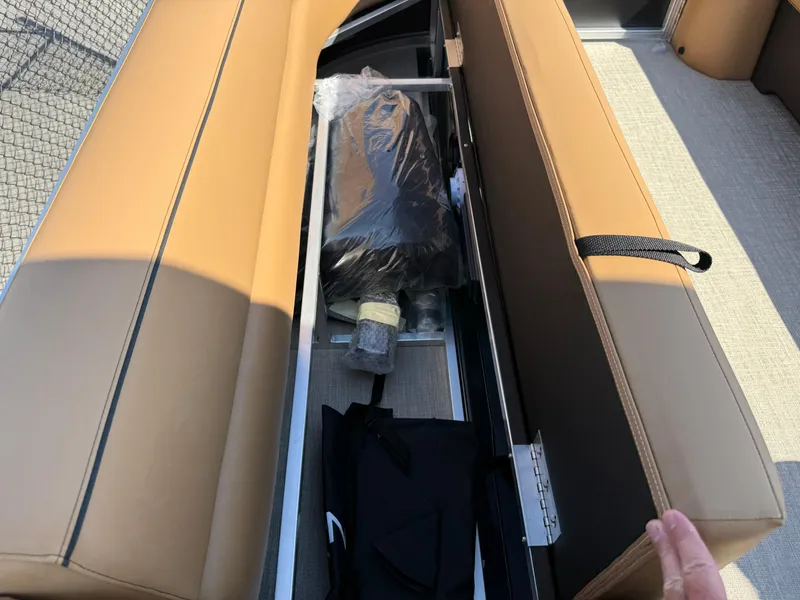 Slide: The Image of 2025 Avalon Venture 85 Versatile rear bench with storage compartment open. - 47