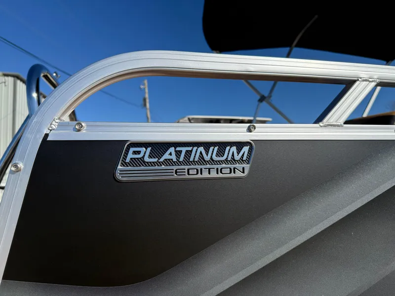 Slide: The Image of 2025 Avalon Venture 85 Versatile rear Bench, Platinum Edition badge on sleek boat exterior. - 8