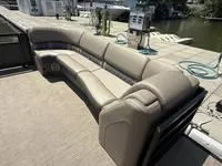 Slide: The Image of Luxurious seating on 2022 Bennington 30 RSRAX2 boat docked by the water. - 13