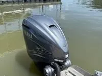 Slide: The Image of Yamaha outboard motor on a 2022 Bennington 30 RSRAX2 boat at a dock. - 19
