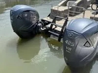 Slide: The Image of 2022 Bennington 30 RSRAX2 with dual Yamaha 425 V8 outboard engines on water. - 20