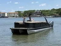 Slide: The Image of 2022 Bennington 30 RSRAX2 pontoon boat on a lake with scenic background. - 3