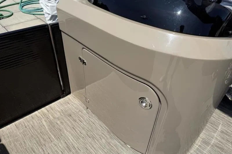 Slide: The Image of 2022 Bennington 30 RSRAX2 boat console with storage compartment and sleek design. - 40