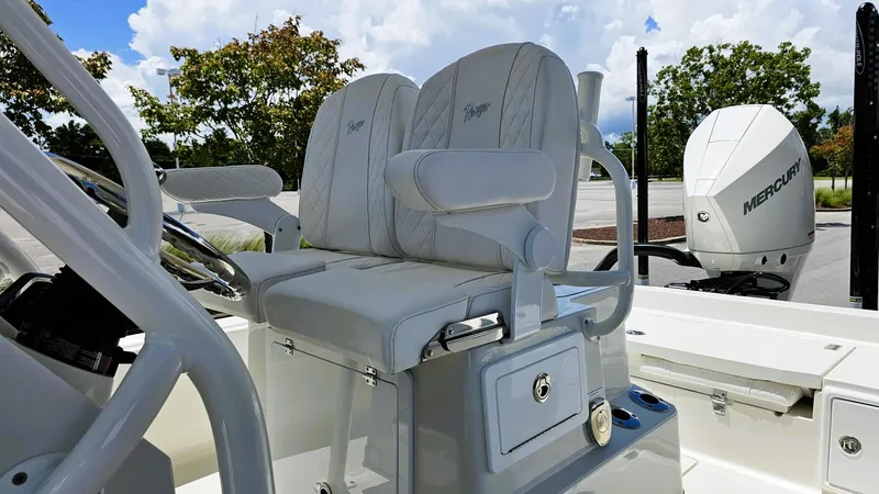 Slide: The Image of 2025 Ranger 2360 Bay boat interior with dual seats and Mercury engine. - 12