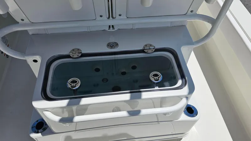 Slide: The Image of Livewell on 2025 Ranger 2360 Bay boat, featuring secure latches and clear lid. - 19