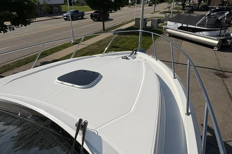 Slide: The Image of 2025 Boston Whaler 365 Conquest boat deck, featuring sleek design and sturdy railings. - 2