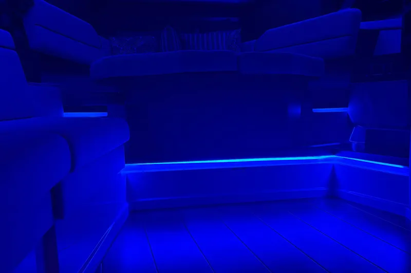 Slide: The Image of 2025 Boston Whaler 365 Conquest interior with ambient blue LED lighting. - 41