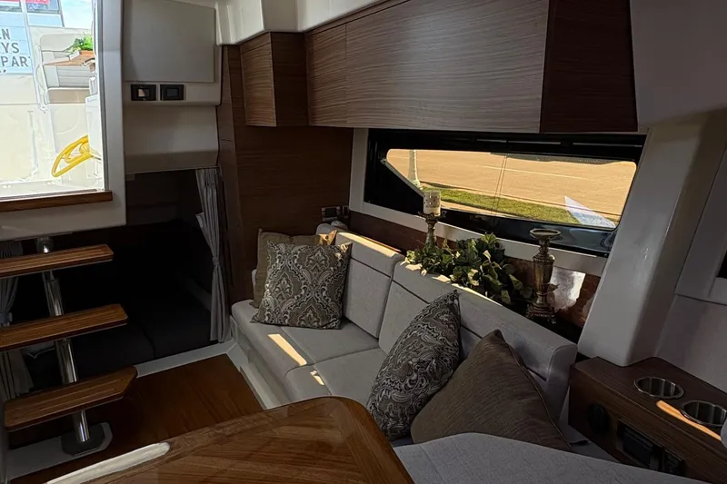 Slide: The Image of Interior of 2025 Boston Whaler 365 Conquest, featuring elegant seating and modern decor. - 6