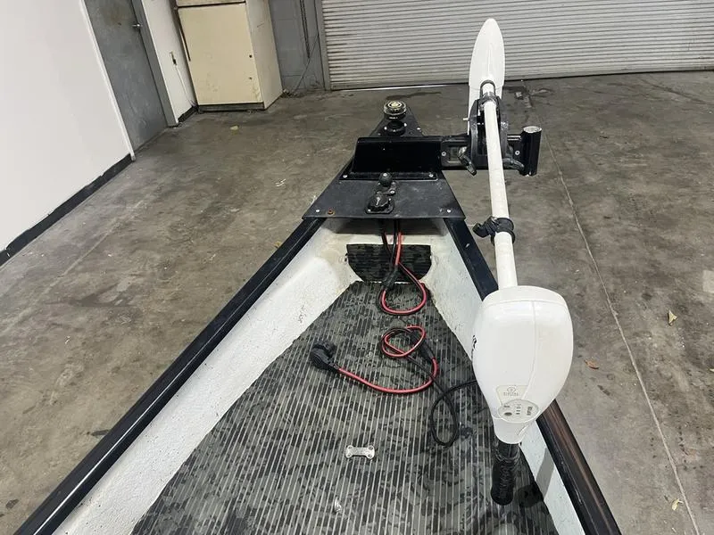 Slide: The Image of 2022 Gheenoe Low Tide 25 boat interior with trolling motor and wiring. - 7