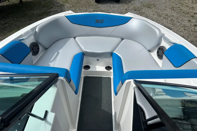Slide: The Image of 2017 MasterCraft NXT22 boat interior with blue and gray seating. - 45