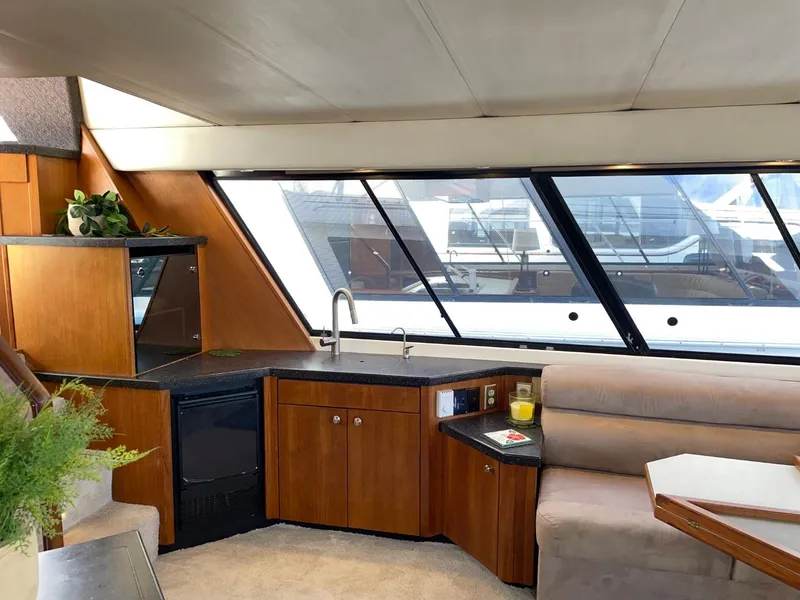 Slide: The Image of Luxurious interior of 1994 Bayliner 4788 Pilot House Motoryacht with modern amenities and sleek design. - 12