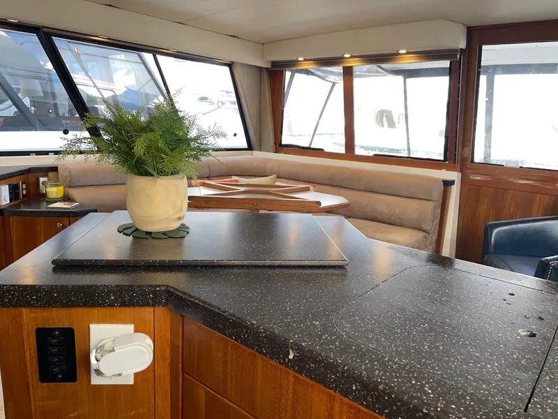Slide: The Image of Interior of 1994 Bayliner 4788 Pilot House Motoryacht with seating and countertop. - 22
