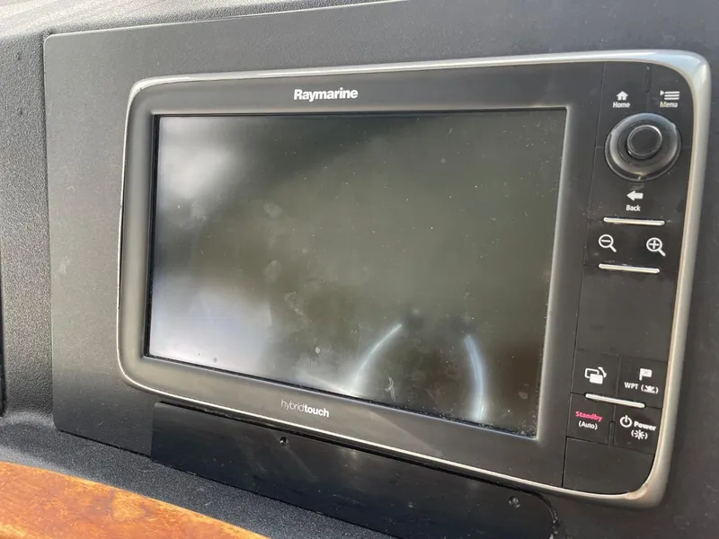 Slide: The Image of Raymarine navigation display on 1994 Bayliner 4788 Pilot House Motoryacht dashboard. - 32