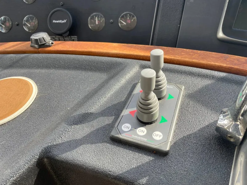 Slide: The Image of Control panel of a 1994 Bayliner 4788 Pilot House Motoryacht with joysticks and gauges. - 33