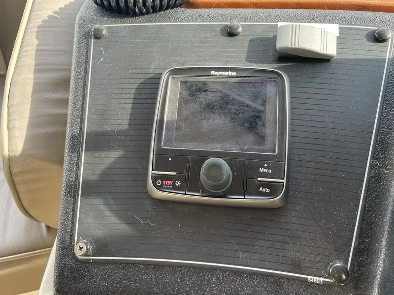 Slide: The Image of Control panel of a 1994 Bayliner 4788 Pilot House Motoryacht with Raymarine display. - 34