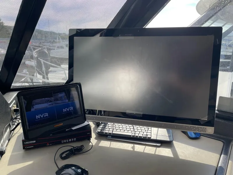 Slide: The Image of Navigation equipment on 1994 Bayliner 4788 Pilot House Motoryacht, featuring monitors and controls. - 36