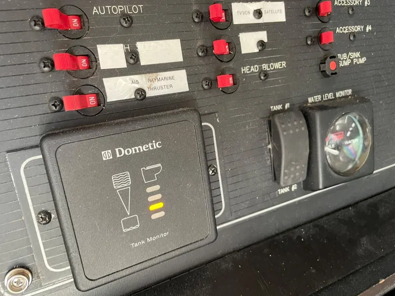 Slide: The Image of Control panel of a 1994 Bayliner 4788 Pilot House Motoryacht with Dometic tank monitor. - 41