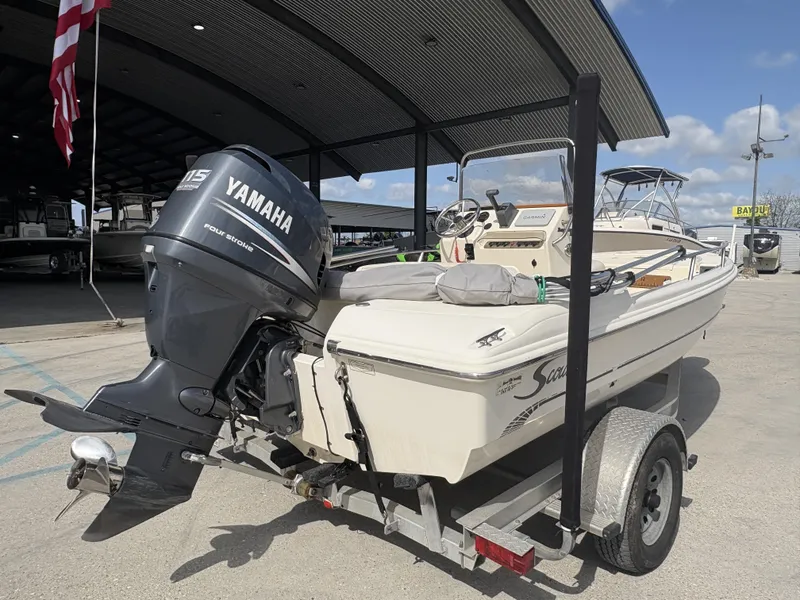 Slide: The Image of 2005 Scout 17 boat with Yamaha 115 outboard motor on a trailer. - 3