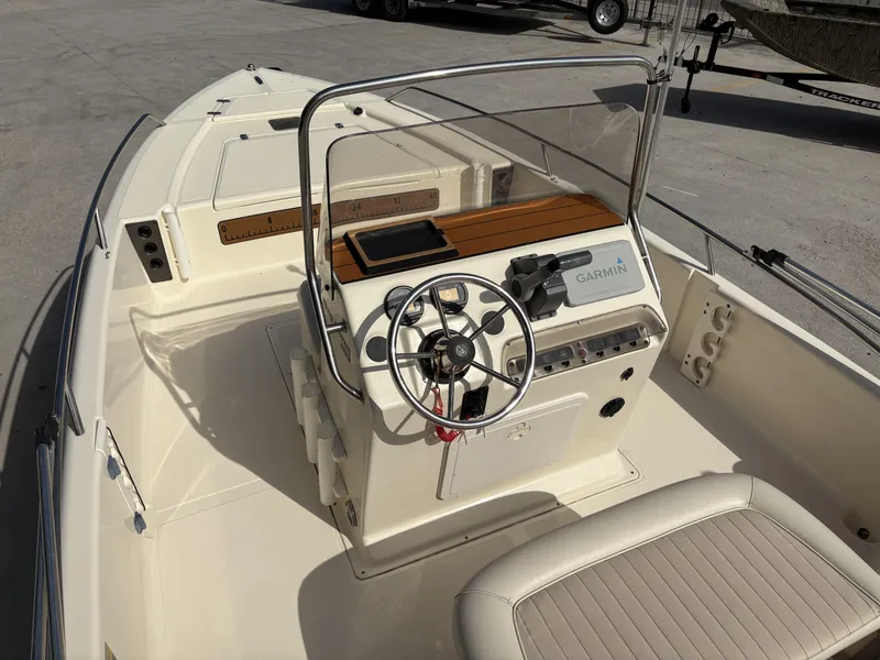 Slide: The Image of 2005 Scout 17 boat interior with steering wheel and Garmin navigation system. - 5