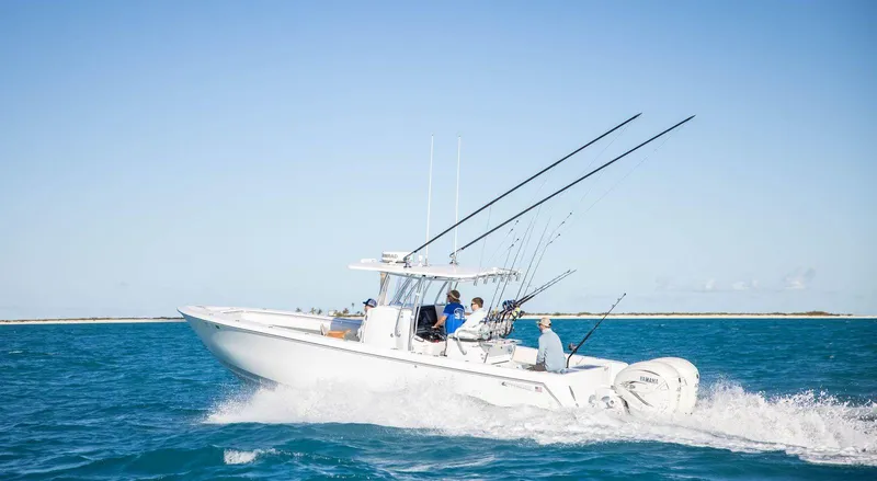 The Image of 2026 Contender 35ST boat cruising on open water with fishing rods. - 1