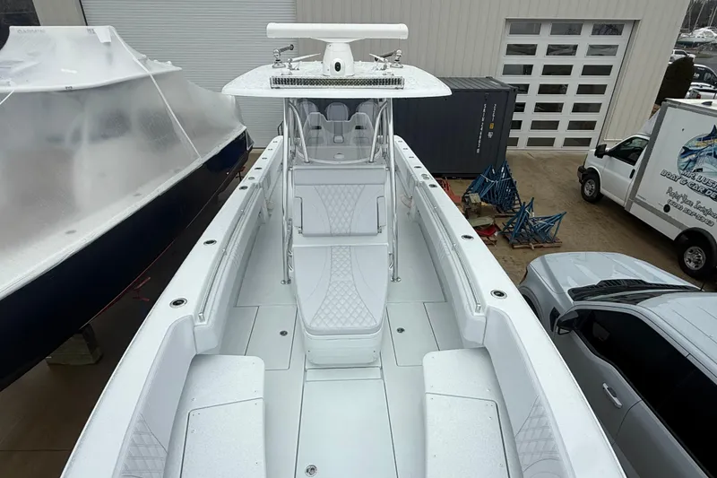 Slide: The Image of 2026 Contender 35 ST boat with sleek white interior and modern design. - 10
