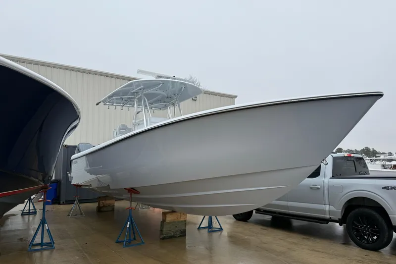 Slide: The Image of 2026 Contender 35 ST boat with triple Yamaha 350 V6 engines on display. - 2
