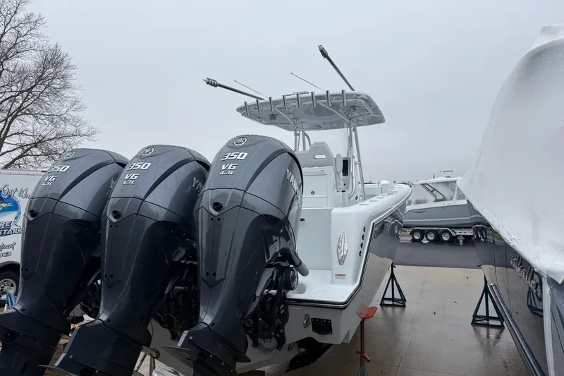 Slide: The Image of 2026 Contender 35 ST boat on stands beside a truck, ready for launch. - 3