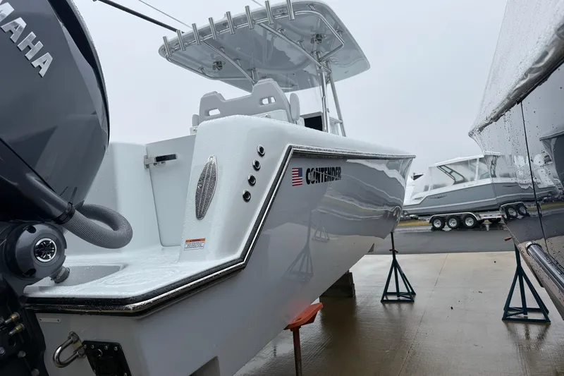 Slide: The Image of 2026 Contender 35 ST boat on stands, featuring sleek design and Yamaha engine. - 4