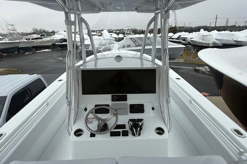 Slide: The Image of 2026 Contender 35 ST boat console with steering wheel and navigation display. - 6