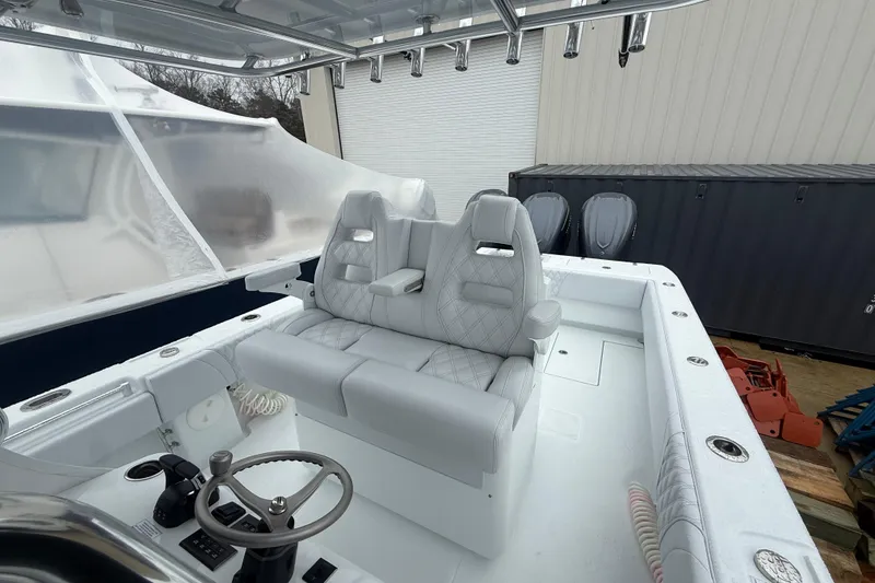 Slide: The Image of 2026 Contender 35 ST boat interior with dual seats and steering console. - 7