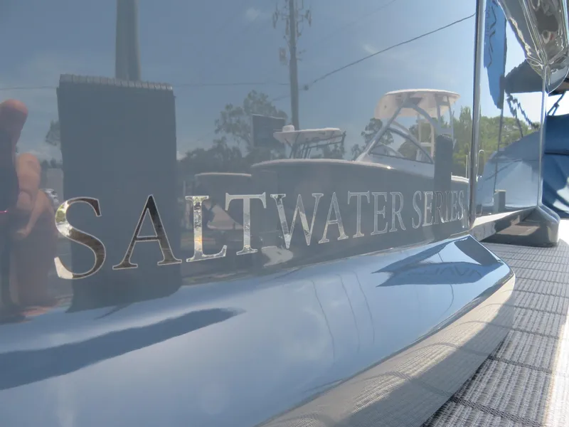 Slide: The Image of 2026 Avalon Excalibur Elite Windshield, Saltwater Series, reflective surface detail. - 13