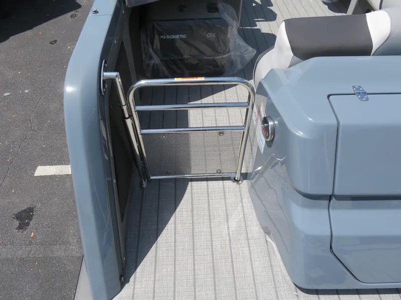 Slide: The Image of 2026 Avalon Excalibur Elite Windshield boat interior with gate and seating. - 15