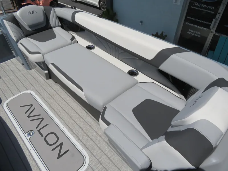 Slide: The Image of Luxurious seating on 2026 Avalon Excalibur Elite Windshield boat, featuring sleek gray upholstery. - 21