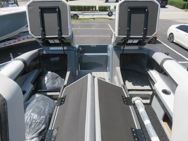 Slide: The Image of 2026 Avalon Excalibur Elite Windshield boat interior with open storage compartments. - 24