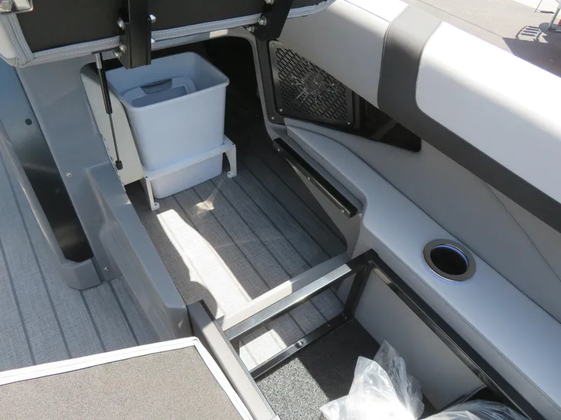 Slide: The Image of Interior of 2026 Avalon Excalibur Elite Windshield boat with storage and seating. - 28