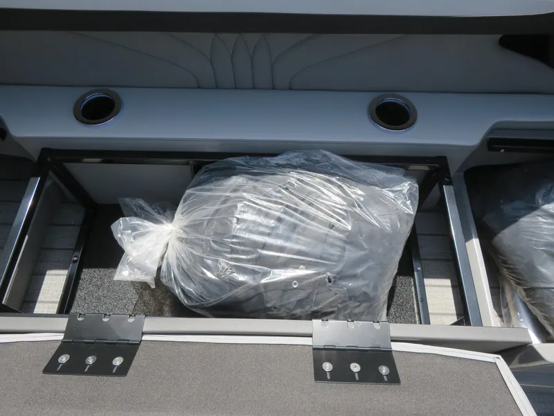 Slide: The Image of Storage compartment of 2026 Avalon Excalibur Elite Windshield with packaged items. - 29
