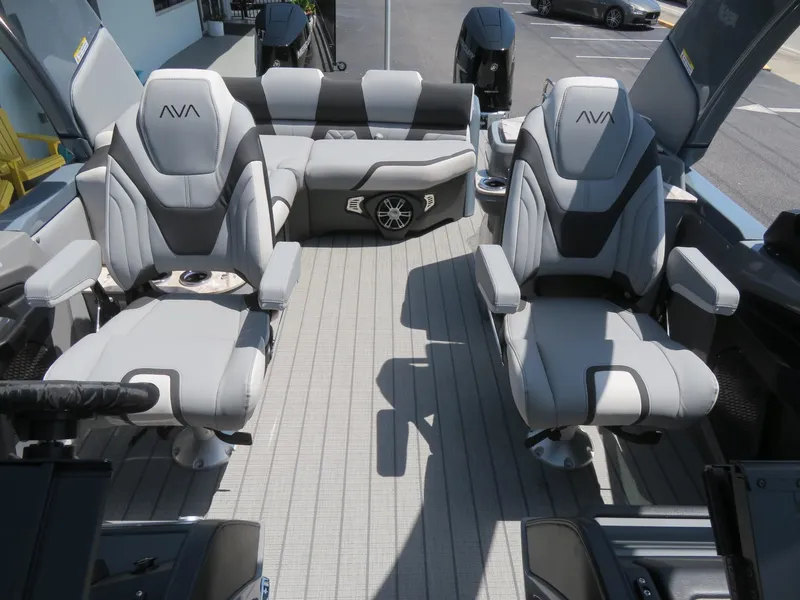 Slide: The Image of Luxurious interior of 2026 Avalon Excalibur Elite Windshield boat with plush seating. - 31