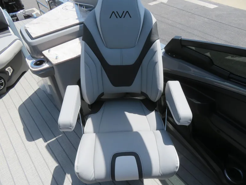 Slide: The Image of Luxurious captain's chair on 2026 Avalon Excalibur Elite Windshield boat, featuring sleek design and comfort. - 33