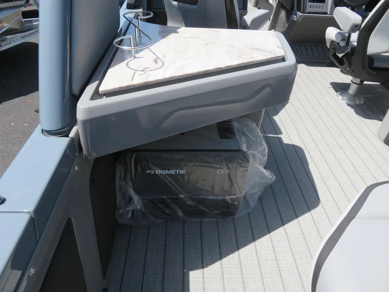 Slide: The Image of 2026 Avalon Excalibur Elite Windshield interior with Dometic CFX cooler under a table. - 39