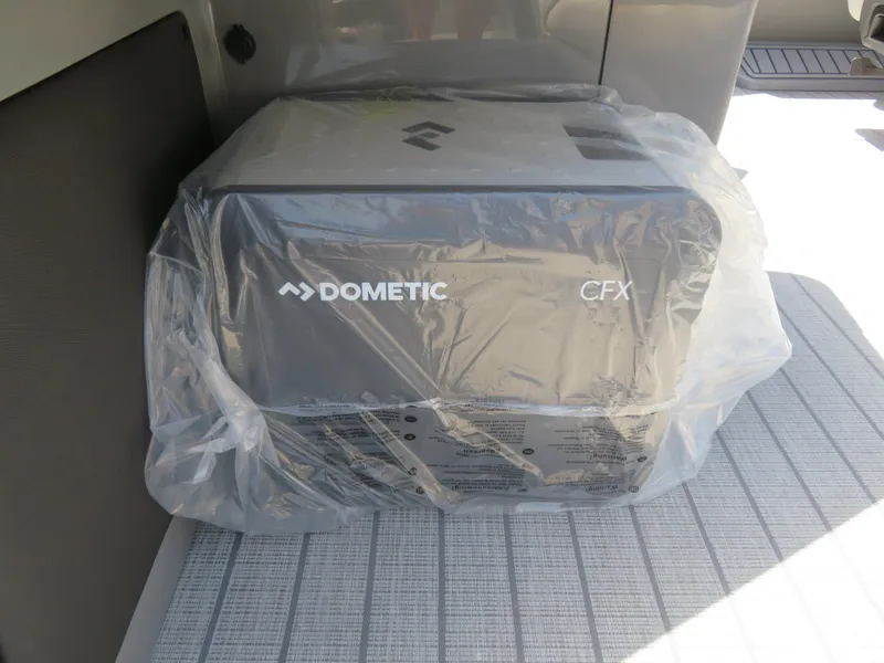 Slide: The Image of Dometic CFX cooler wrapped in plastic, inside Avalon Excalibur Elite Windshield 2026 model. - 41
