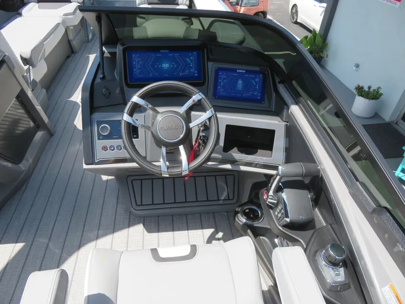 Slide: The Image of 2026 Avalon Excalibur Elite Windshield boat dashboard with modern controls and steering wheel. - 42