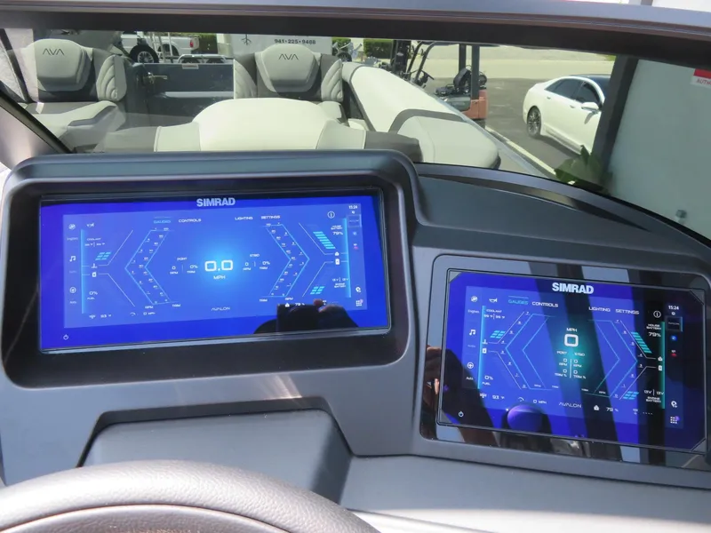 Slide: The Image of Dashboard of 2026 Avalon Excalibur Elite Windshield with dual Simrad displays. - 49