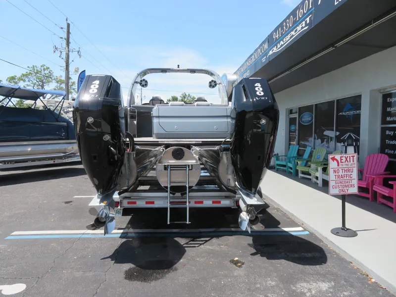 Slide: The Image of 2026 Avalon Excalibur Elite Windshield boat with dual 400 HP engines at a dealership. - 5