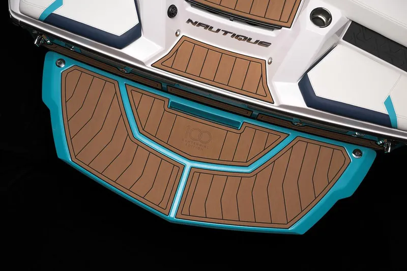 Slide: The Image of 2026 Nautique Super Air Nautique GS22 storage compartment with black bag and orange flooring. - 13