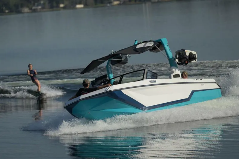 Slide: The Image of 2026 Nautique Super Air Nautique GS22 interior with luxurious seating and wood accents. - 4