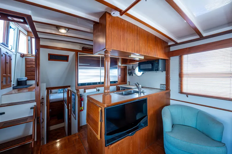 Slide: The Image of Interior of 1993 Kadey-Krogen Krogen 42 yacht with wooden cabinetry and modern amenities. - 10